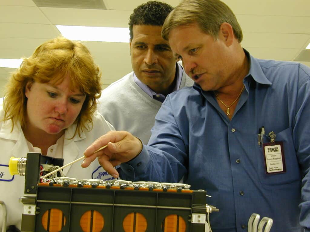 Eagle-Picher Lead Quality Technician (Suzy G.), Lockheed's Shawky Shehata, and Guest Examine LLMS P/N 8A01445-101 Einstein Mission Battery